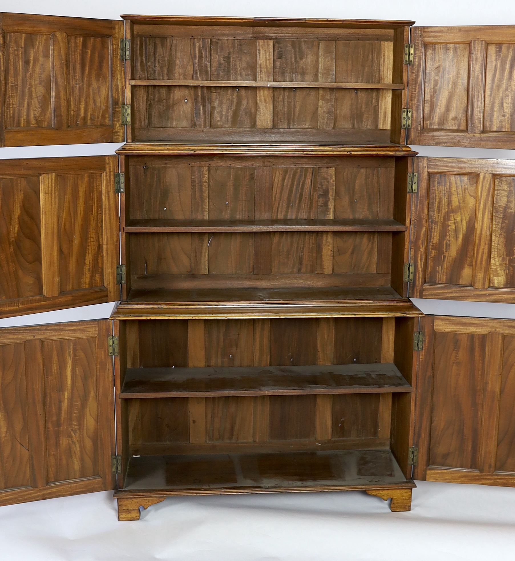An unusual mid 19th century satinwood campaign bookcase, width 110cm, depth 34cm, height 177cm